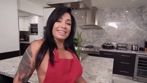 Fingering in the kitchen along with tight brunette