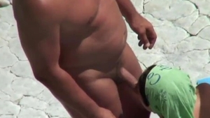 Nude girl digs nudist sloppy fucking at the beach in HD