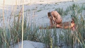 Muscle couple caught sucking cock at the beach
